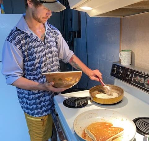cooking pancakes on the stove.