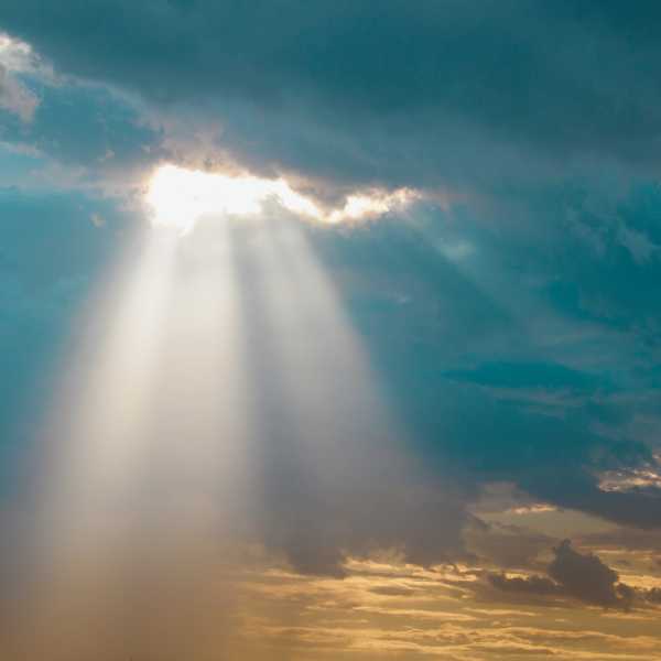 Joy breaking through the clouds as a beam of light.